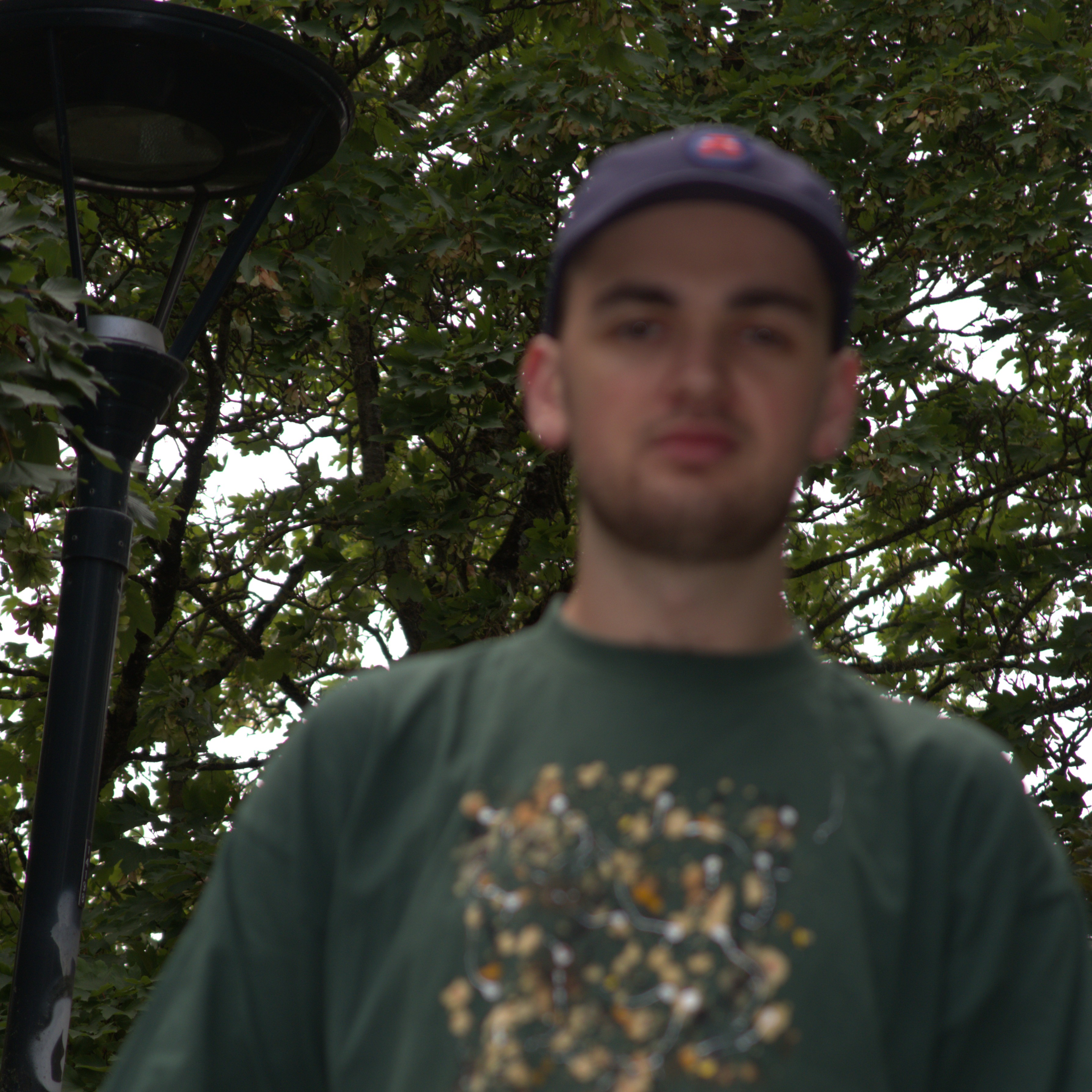 A picture of Mathis in front of some trees on a small bridge in Rennes.